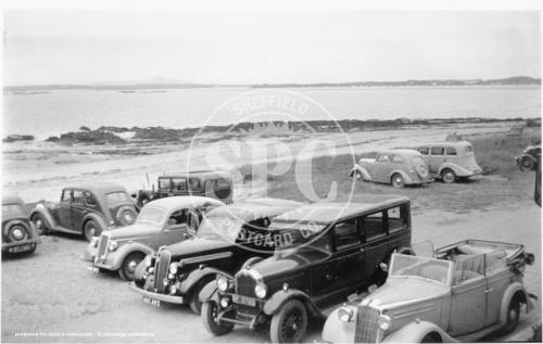 Beach Terrace with old cars parked up, Rhosneigr.