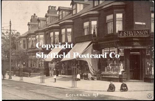 spc597: Ecclesall Rd (Jn Harefield Rd) (2 boys seated x-legged on pavenment)